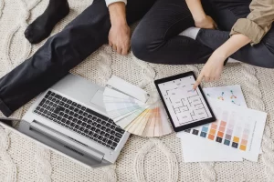 Woman and man making plans with the help of laptop