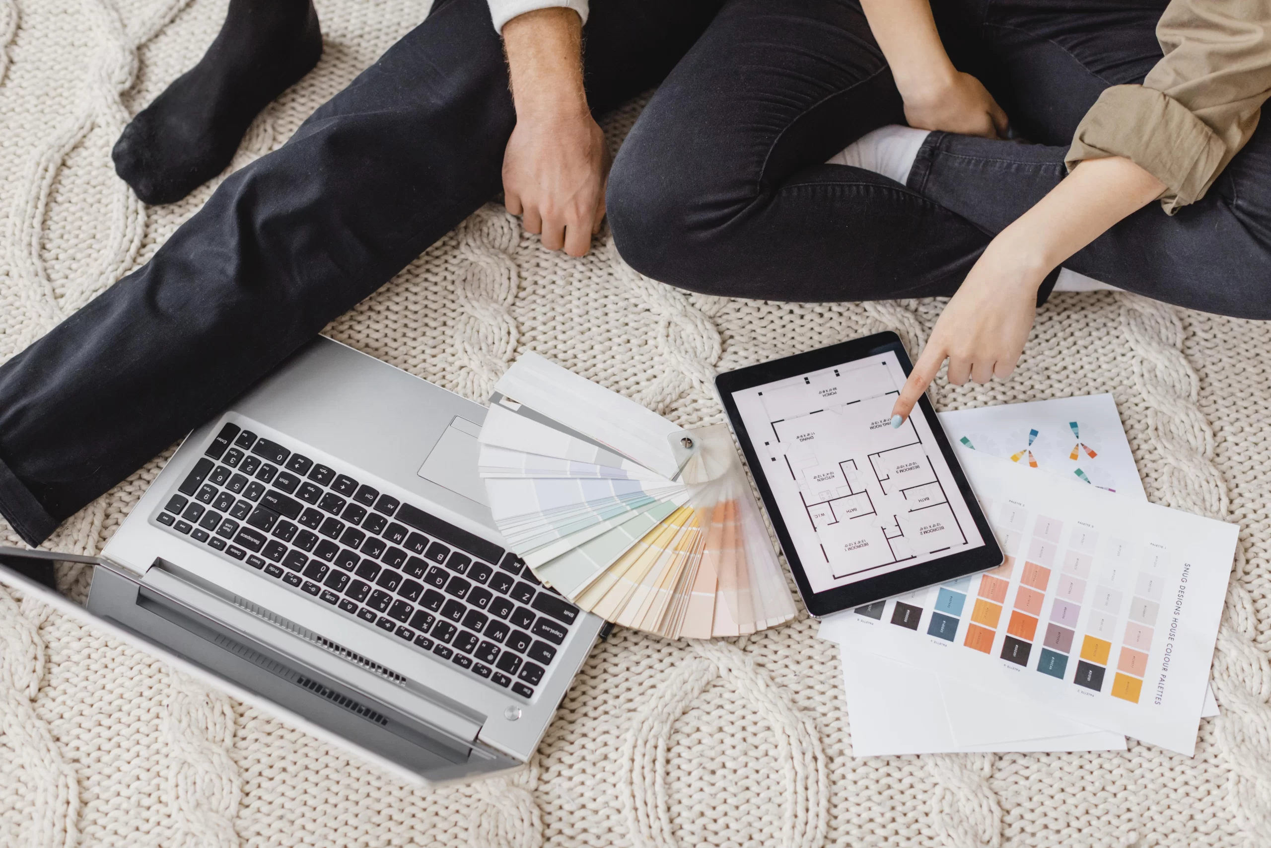 Woman and man making plans with the help of laptop